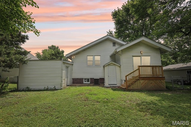 413 E Beach St, Litchfield, IL 62056 - back of house at dusk featuring an outbuilding