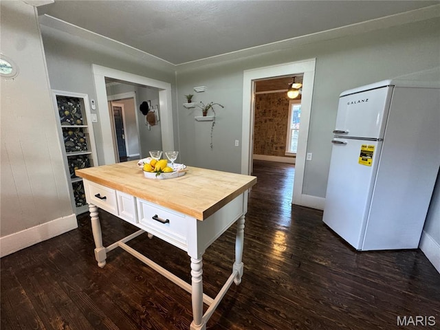 719 N 10th St, Poplar Bluff, MO 63901 - dining room featuring dark wood-type flooring