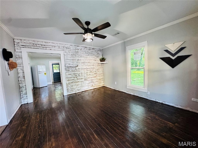 719 N 10th St, Poplar Bluff, MO 63901 - spare room featuring wood-type flooring, ceiling fan, plenty of natural light, and crown molding
