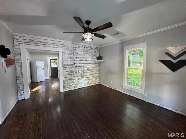 719 N 10th St, Poplar Bluff, MO 63901 - spare room with hardwood / wood-style floors, healthy amount of natural light, ceiling fan, and crown molding