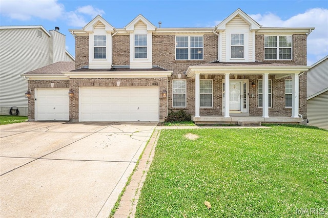 1016 Scenic Oaks Ct, Imperial, MO 63052 - view of front of property featuring brick siding, concrete driveway, covered porch, and a front yard