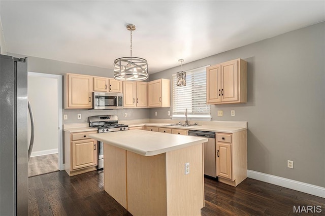 1016 Scenic Oaks Ct, Imperial, MO 63052 - kitchen with appliances with stainless steel finishes, light brown cabinetry, light countertops, and dark wood finished floors