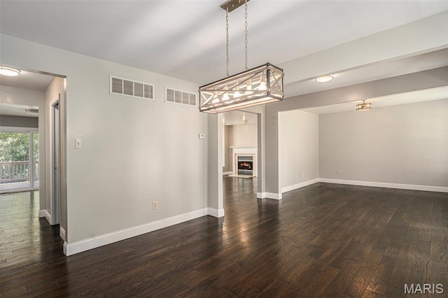 1016 Scenic Oaks Ct, Imperial, MO 63052 - spare room with dark wood-style flooring and a lit fireplace