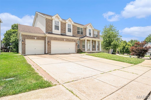 1016 Scenic Oaks Ct, Imperial, MO 63052 - view of front of house with a front lawn, driveway, and brick siding
