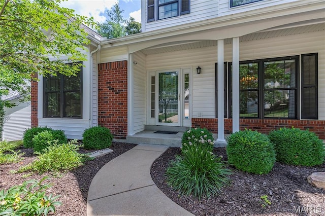 2260 Crimson View Dr, Wildwood, MO 63011 - doorway to property with brick siding and a porch