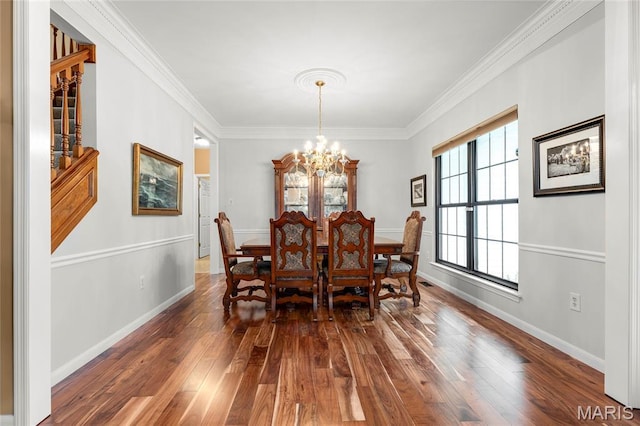 2260 Crimson View Dr, Wildwood, MO 63011 - dining area with a chandelier, dark wood-style flooring, and ornamental molding