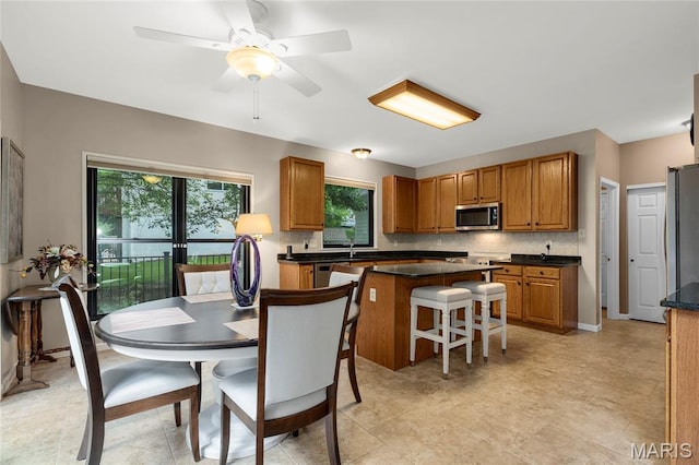 2260 Crimson View Dr, Wildwood, MO 63011 - kitchen with stainless steel appliances, healthy amount of natural light, and dark countertops