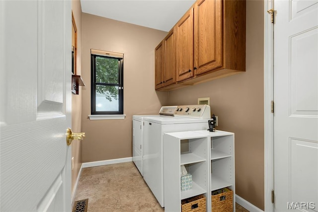 2260 Crimson View Dr, Wildwood, MO 63011 - laundry area with independent washer and dryer and cabinet space