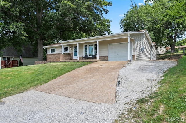 1117 Nelda Dr, Imperial, MO 63052 - ranch-style home featuring an attached garage, driveway, a porch, a front lawn, and brick siding