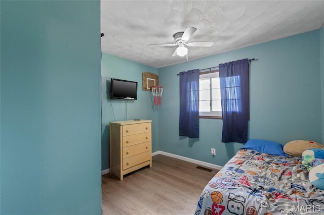 1117 Nelda Dr, Imperial, MO 63052 - bedroom with wood finished floors and a ceiling fan