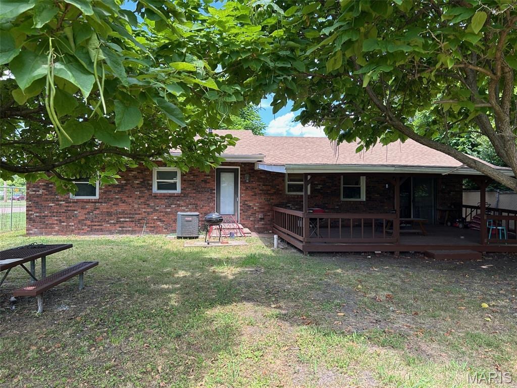 414 Cooper Dr, Cahokia, IL 62206 - back of property with brick siding and a deck