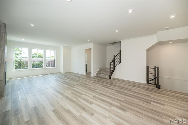 8971 Eager Rd, Richmond Heights, MO 63144 - unfurnished living room with recessed lighting, light wood-style floors, stairway, and crown molding
