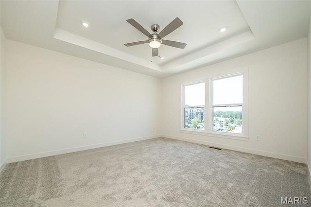8971 Eager Rd, Richmond Heights, MO 63144 - empty room featuring a tray ceiling, ceiling fan, carpet floors, and recessed lighting