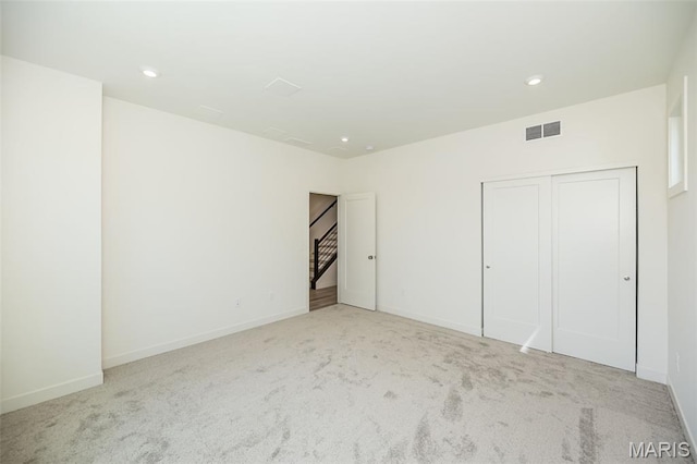8971 Eager Rd, Richmond Heights, MO 63144 - unfurnished bedroom with carpet, a closet, and recessed lighting
