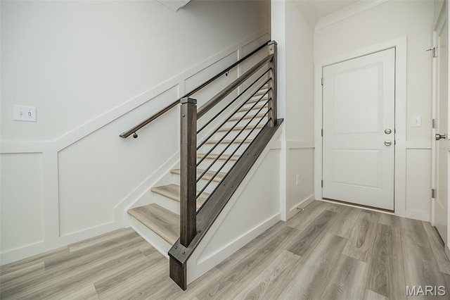 8971 Eager Rd, Richmond Heights, MO 63144 - staircase featuring wood finished floors
