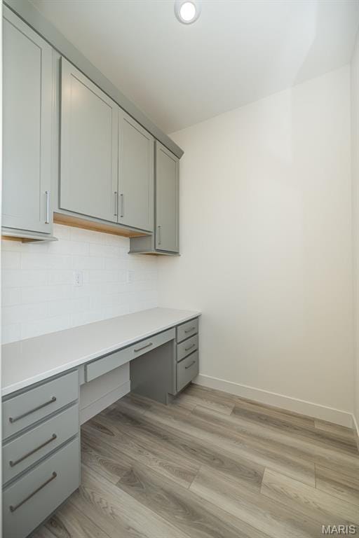 8971 Eager Rd, Richmond Heights, MO 63144 - unfurnished office with built in desk and light wood finished floors