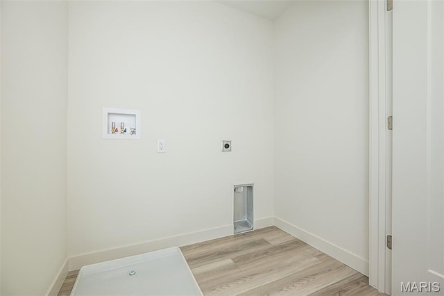 8971 Eager Rd, Richmond Heights, MO 63144 - laundry area with electric dryer hookup, washer hookup, and light wood-style floors