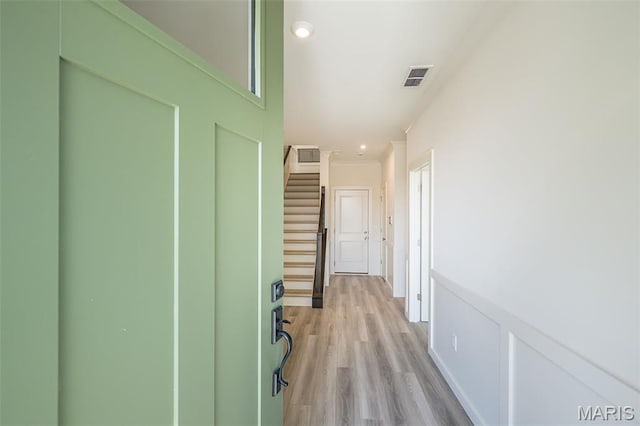 8971 Eager Rd, Richmond Heights, MO 63144 - corridor with light wood finished floors and stairs