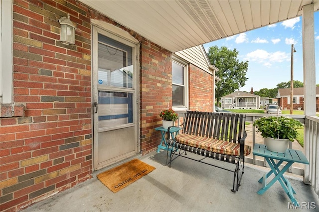 2648 E 27th St, Granite City, IL 62040 - doorway to property with a porch and brick siding