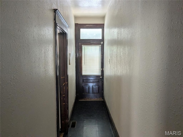 3744 Michigan Ave, Saint Louis, MO 63118 - hallway with baseboards and a textured wall