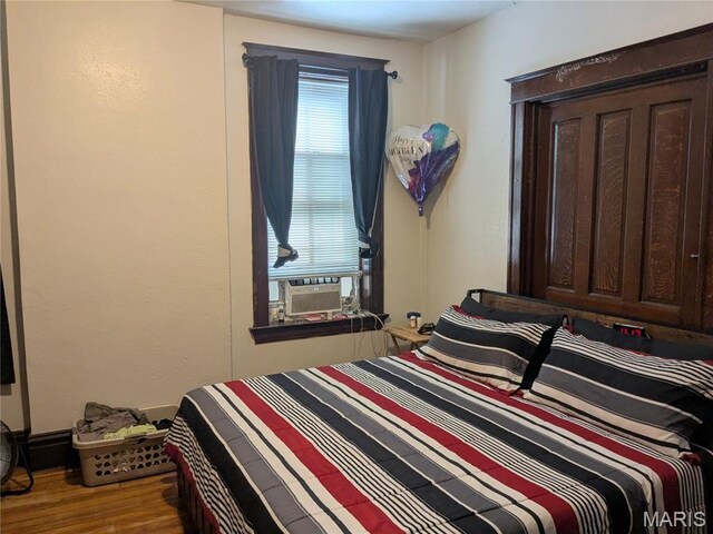 3744 Michigan Ave, Saint Louis, MO 63118 - bedroom with cooling unit and wood finished floors