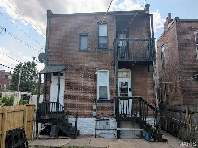 3744 Michigan Ave, Saint Louis, MO 63118 - townhome / multi-family property with a balcony and brick siding