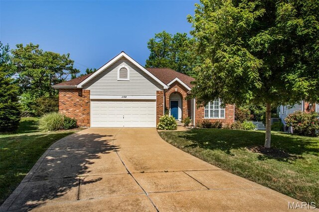 1168 Oak Knoll Manor Ct, Saint Louis, MO 63119 - view of front of property with brick siding, a front yard, concrete driveway, and an attached garage