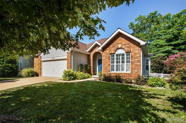 1168 Oak Knoll Manor Ct, Saint Louis, MO 63119 - view of front of home featuring brick siding, driveway, and an attached garage