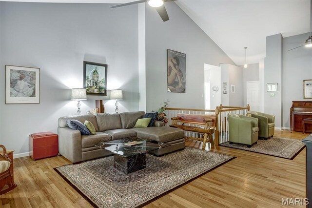 1168 Oak Knoll Manor Ct, Saint Louis, MO 63119 - living area with ceiling fan, high vaulted ceiling, and light wood-style flooring
