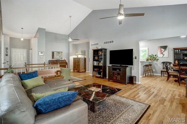 1168 Oak Knoll Manor Ct, Saint Louis, MO 63119 - living room featuring ceiling fan, high vaulted ceiling, and light wood finished floors