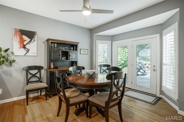 1168 Oak Knoll Manor Ct, Saint Louis, MO 63119 - dining area with light wood-style flooring and a ceiling fan