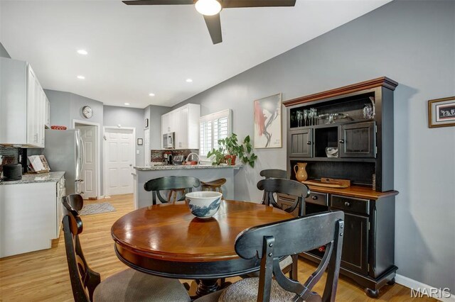 1168 Oak Knoll Manor Ct, Saint Louis, MO 63119 - dining room with light wood-style floors, a ceiling fan, and recessed lighting