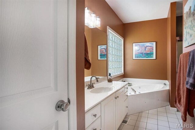 1168 Oak Knoll Manor Ct, Saint Louis, MO 63119 - bathroom featuring vanity, a garden tub, and tile patterned flooring