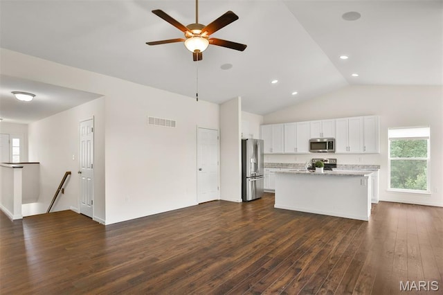 2904 Sierra View Ct, Imperial, MO 63052 - kitchen with stainless steel appliances, dark wood-type flooring, ceiling fan, white cabinetry, and healthy amount of natural light