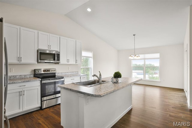2904 Sierra View Ct, Imperial, MO 63052 - kitchen featuring appliances with stainless steel finishes, vaulted ceiling, dark wood-type flooring, white cabinets, and recessed lighting