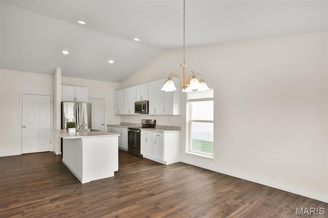 2904 Sierra View Ct, Imperial, MO 63052 - kitchen with stainless steel appliances, a chandelier, dark wood-type flooring, white cabinets, and an island with sink