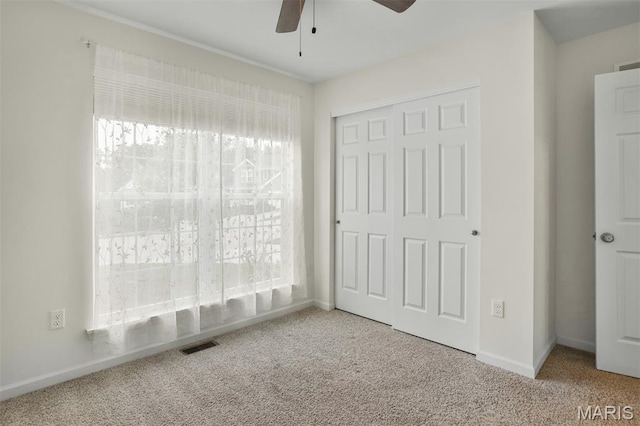 2904 Sierra View Ct, Imperial, MO 63052 - unfurnished bedroom featuring carpet flooring, a closet, and ceiling fan