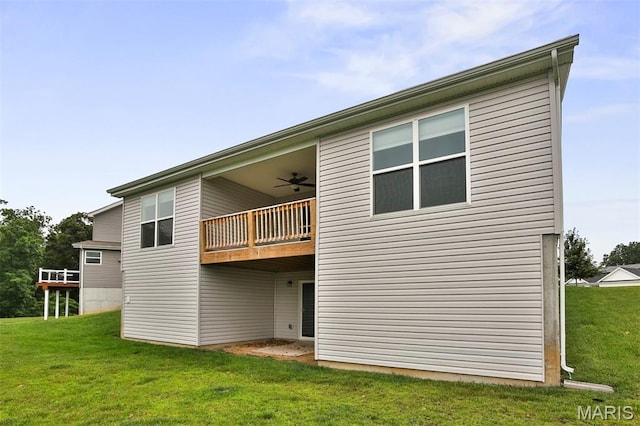 2904 Sierra View Ct, Imperial, MO 63052 - rear view of property featuring a lawn, a ceiling fan, and a balcony