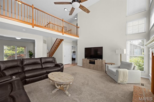 1211 Conrad Ln, Ofallon, IL 62269 - carpeted living area featuring high vaulted ceiling, stairs, and ceiling fan