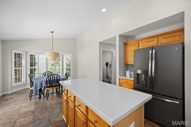 1211 Conrad Ln, Ofallon, IL 62269 - kitchen featuring refrigerator with ice dispenser, light countertops, a kitchen island, stone finish floors, and vaulted ceiling