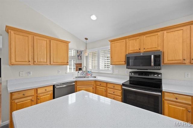 1211 Conrad Ln, Ofallon, IL 62269 - kitchen with appliances with stainless steel finishes, lofted ceiling, light countertops, decorative light fixtures, and recessed lighting