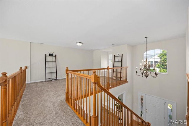 1211 Conrad Ln, Ofallon, IL 62269 - hall with an upstairs landing, a chandelier, and light carpet