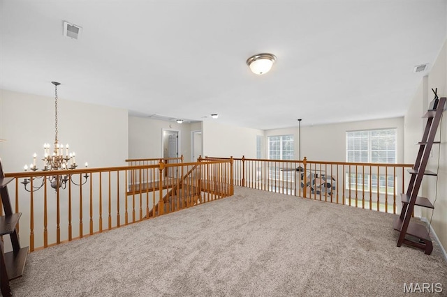 1211 Conrad Ln, Ofallon, IL 62269 - carpeted empty room featuring a chandelier