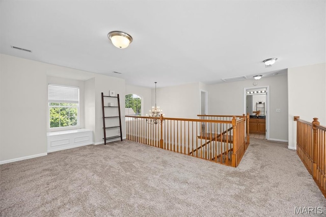 1211 Conrad Ln, Ofallon, IL 62269 - spare room featuring light carpet and a chandelier
