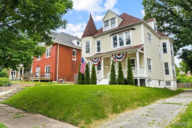 5829 Bartmer Ave, Saint Louis, MO 63112 - victorian-style house with covered porch and a front lawn