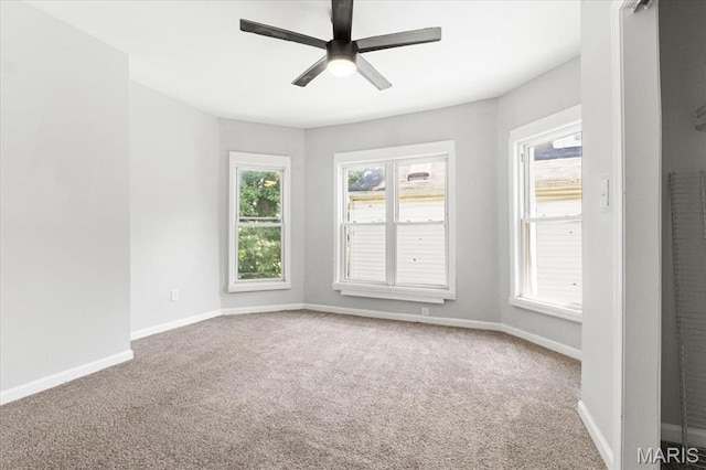 5829 Bartmer Ave, Saint Louis, MO 63112 - carpeted spare room with a ceiling fan and healthy amount of natural light