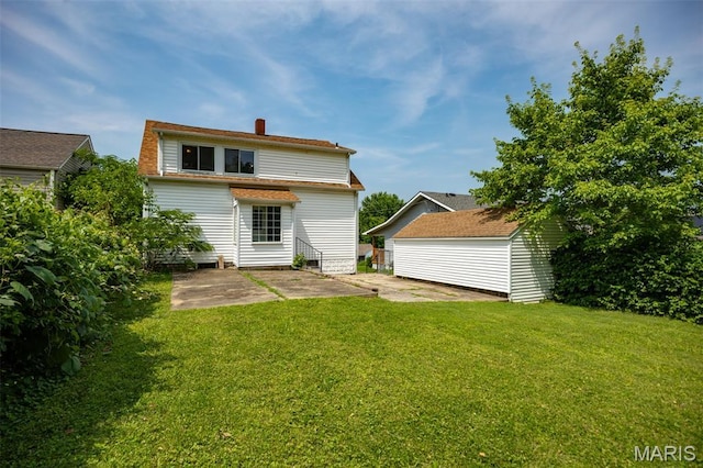 3513 Coronado Dr, Alton, IL 62002 - rear view of house with a patio, a yard, a chimney, and an outbuilding