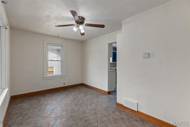 3513 Coronado Dr, Alton, IL 62002 - tiled spare room with ceiling fan and baseboards