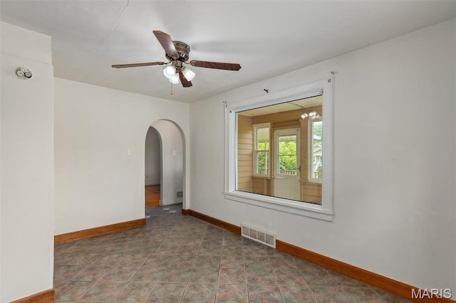 3513 Coronado Dr, Alton, IL 62002 - spare room with arched walkways and a ceiling fan