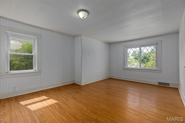 3513 Coronado Dr, Alton, IL 62002 - unfurnished room with wood finished floors and healthy amount of natural light